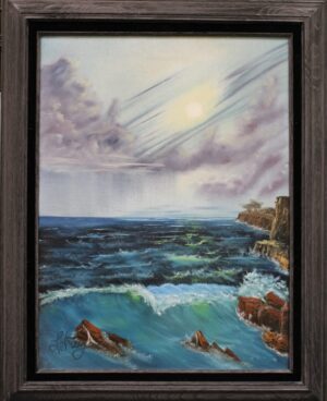 Framed painting of rocks and ocean waves