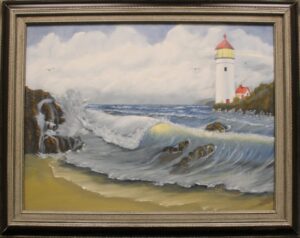 framed painting of a beach with waves and a lighthouse