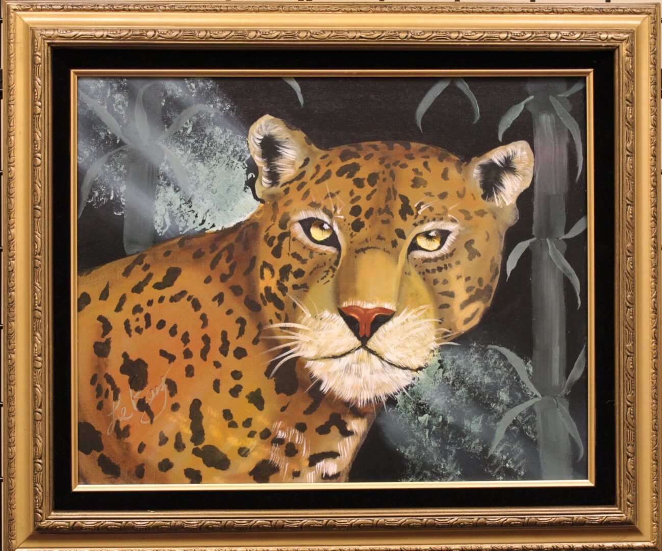 A framed painting of a jaguar