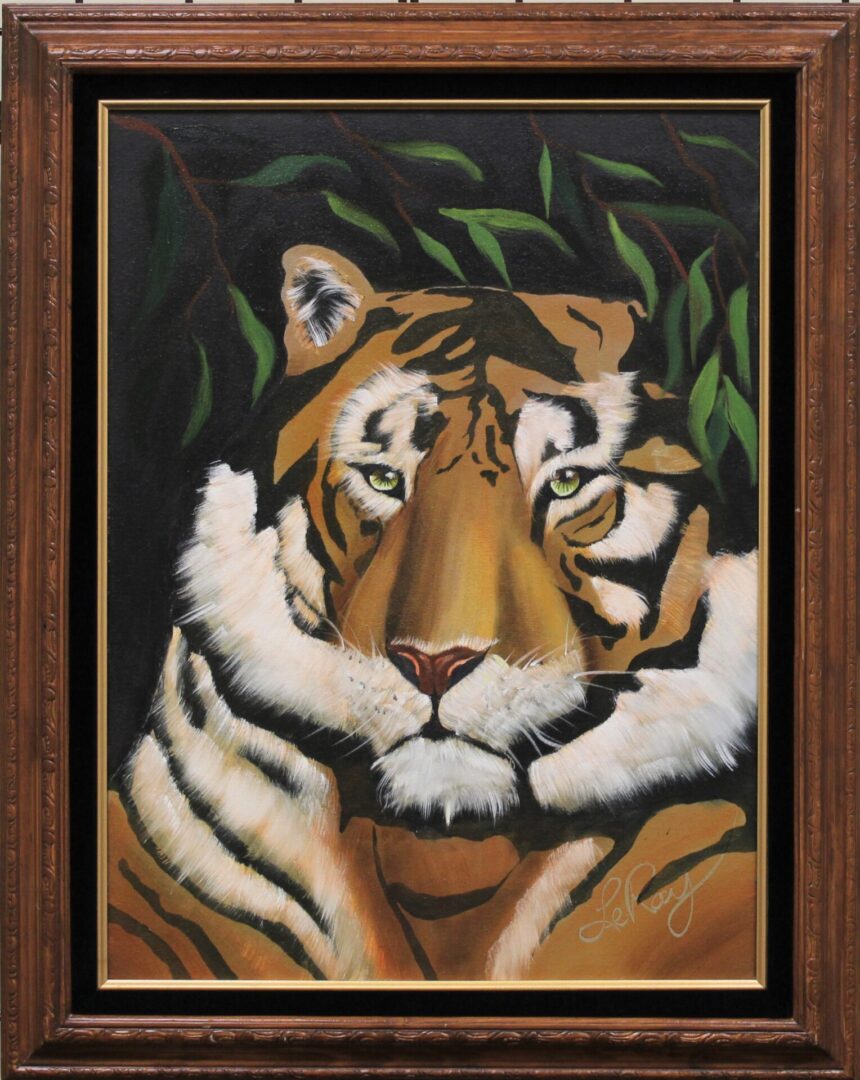 A framed painting of a tiger