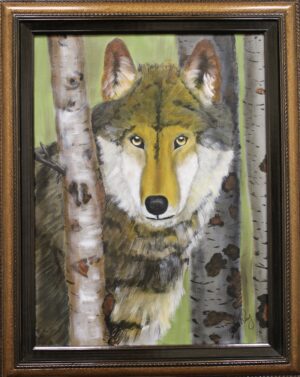 A framed painting of a wolf