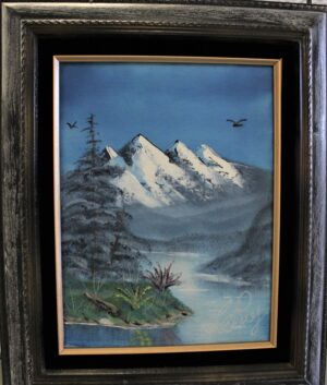 Painting of a mountain scenery with a black frame