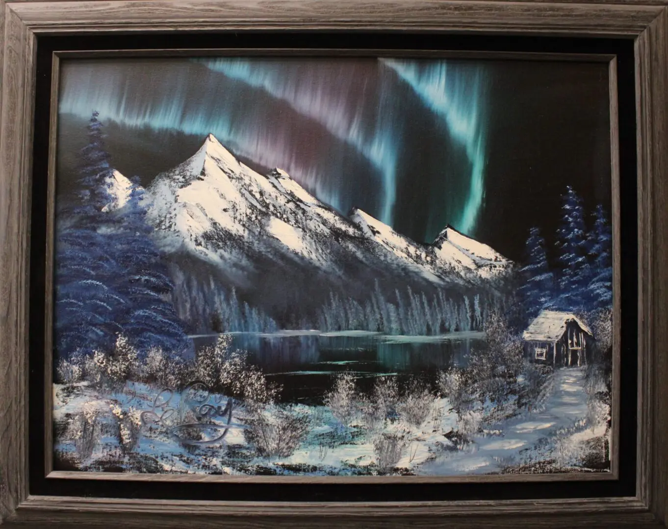 Painting of a northern lights with a black frame