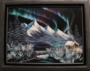 Painting of northern lights with a black frame